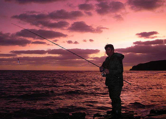 Jonathan still fishing enthusiastically as the sun rises.