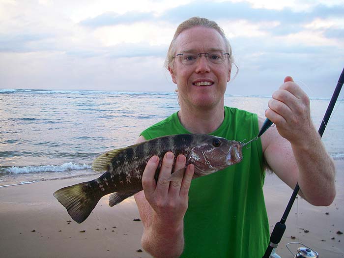 My third son Richard with a grouper caught from a Brazilian beach.