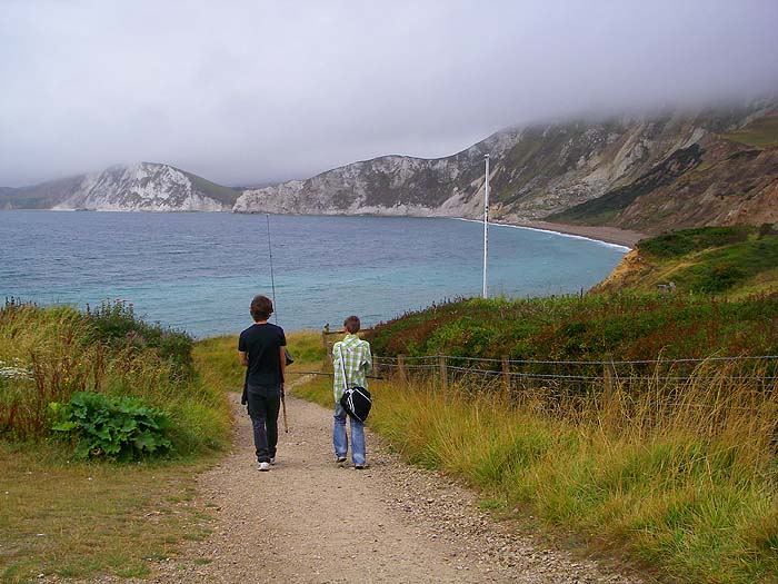 Grandsons James and Ben make their way down into picturesque Worbarrow Bay to fish for wrasse.