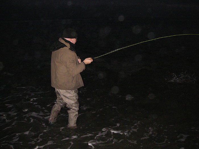 Nigel's rod bends as the mullet feels the hook and splashes on the surface.