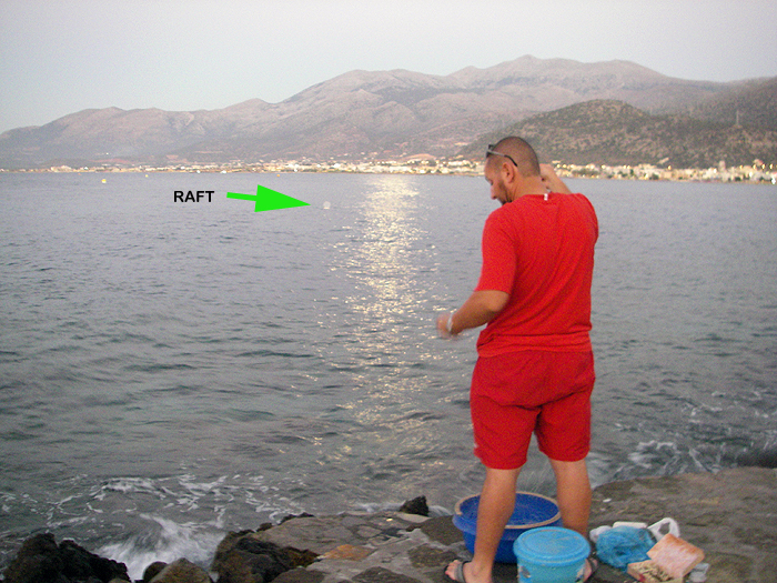 The green arrow shows the position of the raft. Salamis in the town in the background.