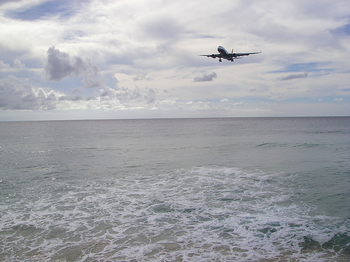 The Monarch plane from Gatwick crossing the beach at Crown point as it lands in Tobago.