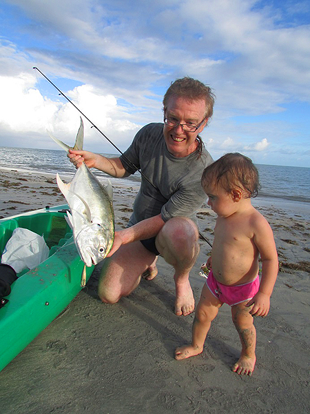 Jasmine, aged 13 months, inspects Dad's catch.
