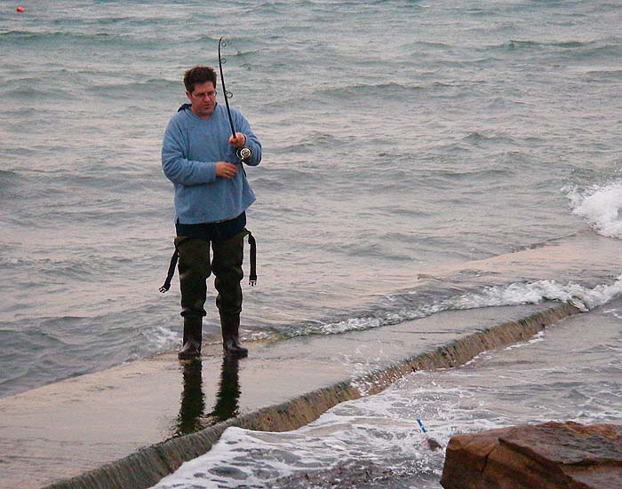 Phil walks his fish back to the shallows for unhooking.