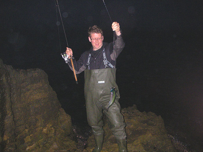 It's still pretty gloomy as Ben swings his mackerel ashore.