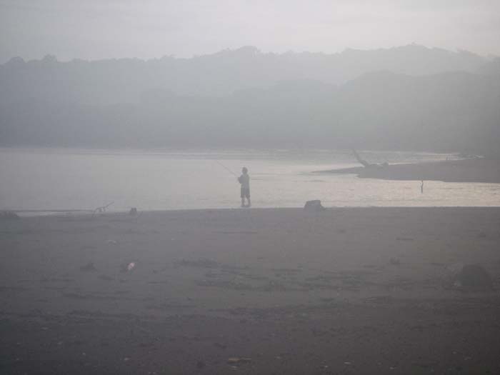 Rich fishing the river mouth. The camara lens was misted up due to the high humidity (it's the rainy season).